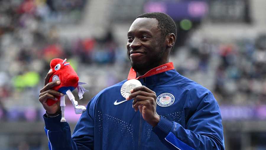 PARIS, FRANCE - SEPTEMBER 05: Silver medalist, Derek Loccident of Team United States, poses for a photo during the medal ceremony for the Men&apos;s Long Jump T64 Final on day eight of the Paris 2024 Summer Paralympic Games at Stade de France on September 05, 2024 in Paris, France. (Photo by Tullio M. Puglia/Getty Images for IPC)