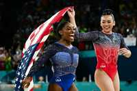 TOPSHOT - Winner US&apos; Simone Biles and third-placed US&apos; Sunisa Lee celebrate after the artistic gymnastics women&apos;s all around final during the Paris 2024 Olympic Games at the Bercy Arena in Paris, on August 1, 2024. (Photo by Loic VENANCE / AFP) (Photo by LOIC VENANCE/AFP via Getty Images)