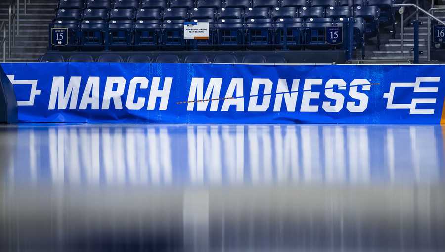 March Madness branding near the court before a first-round college basketball game.